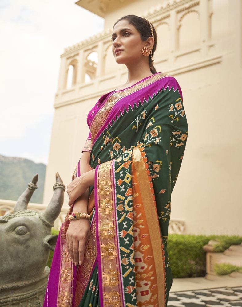 Collection of Gorgeous Dark Green Floral Patola Saree in a gallery layout