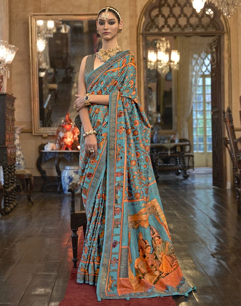 Collection of Sky Blue Floral Pattern Patola Mica Print Saree in a gallery layout