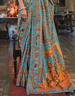 Collection of Sky Blue Floral Pattern Patola Mica Print Saree in a gallery layout