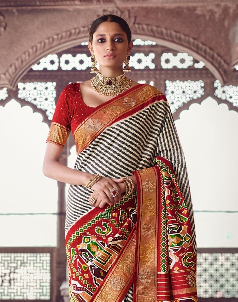 Collection of Black Coloured Ethnic Motifs Patola Saree in a gallery layout