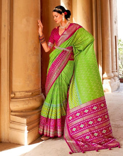 Collection of Parrot Green Chevron Patola Fabric Saree in a gallery layout