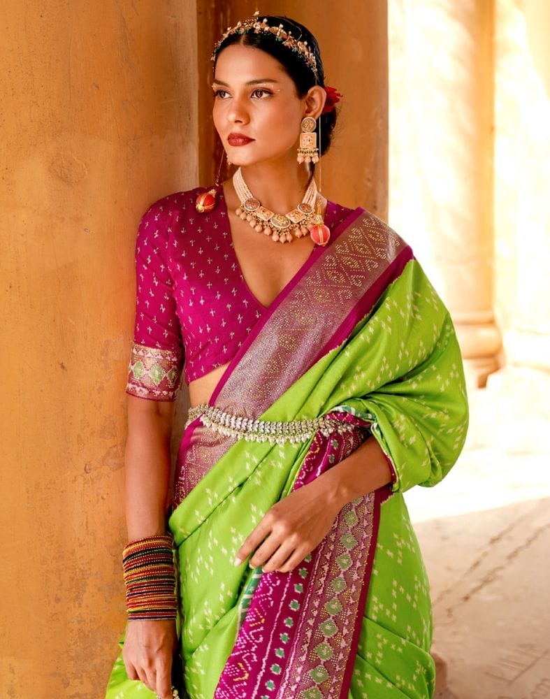 Collection of Parrot Green Chevron Patola Fabric Saree in a gallery layout