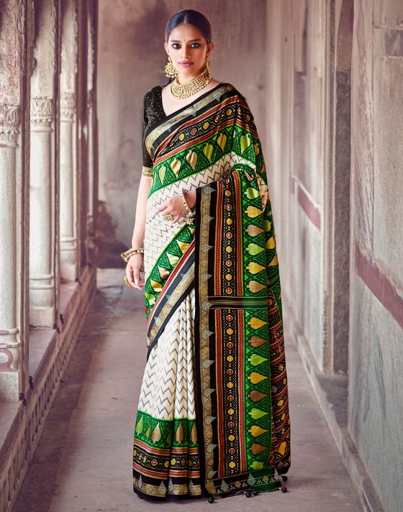 Collection of Off White Chevron Pattern Patola Fabric Saree in a gallery layout