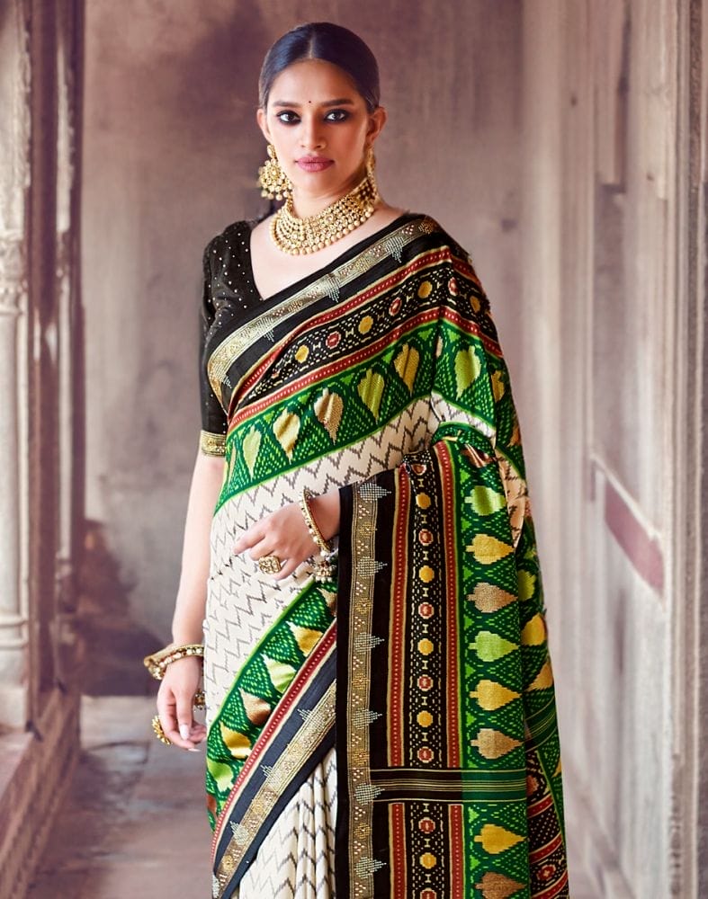 Collection of Off White Chevron Pattern Patola Fabric Saree in a gallery layout