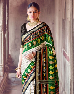 Collection of Off White Chevron Pattern Patola Fabric Saree in a gallery layout