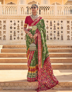 Collection of Stylish Mehendi Green Ikat Print Patola Saree in a gallery layout