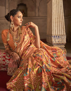 Collection of Orange Ikat Weaving Patola Saree in a gallery layout