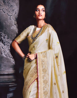 Collection of Cream Floral Banaras Tissue Saree in a gallery layout