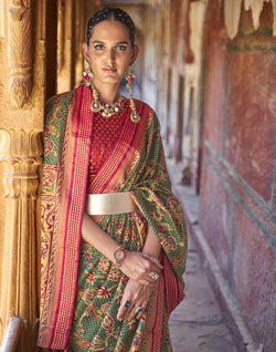 Collection of Trending Patola Green Coloured Botanical Print Saree in a gallery layout