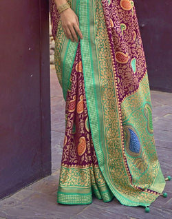 Collection of Magenta and Sea Green Coloured Brasso Saree in a gallery layout