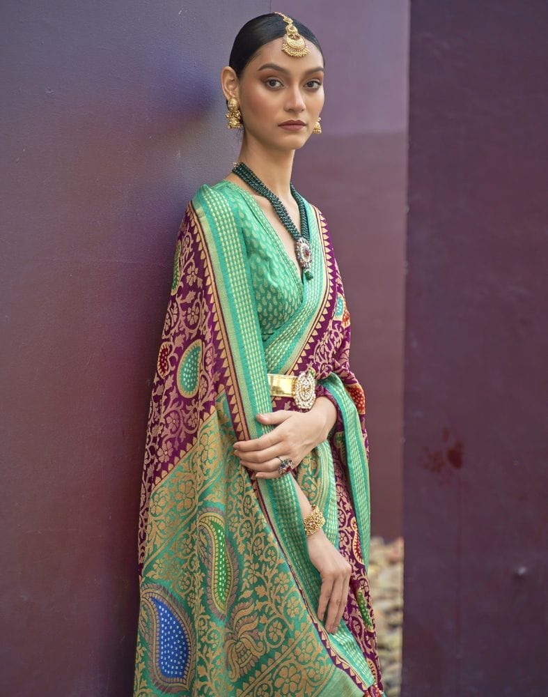 Collection of Magenta and Sea Green Coloured Brasso Saree in a gallery layout