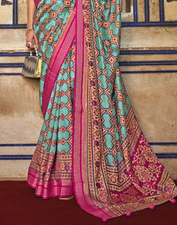 Collection of Magnificent Sky Blue Geometric Print Patola Saree in a gallery layout