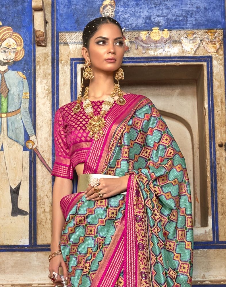 Collection of Magnificent Sky Blue Geometric Print Patola Saree in a gallery layout