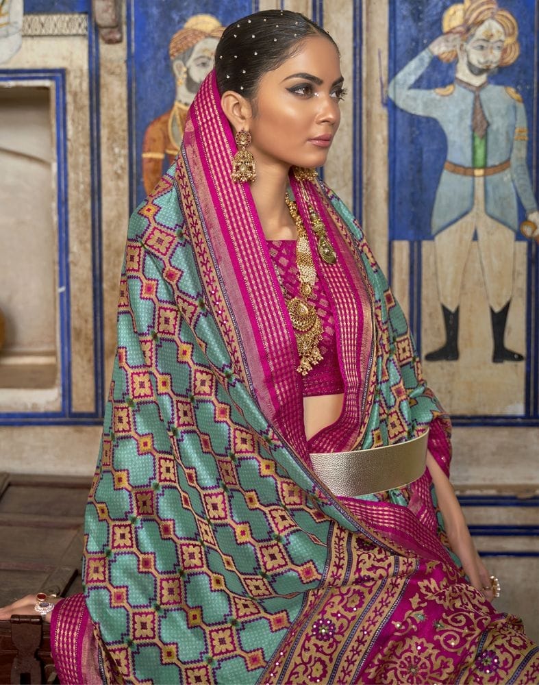 Collection of Magnificent Sky Blue Geometric Print Patola Saree in a gallery layout