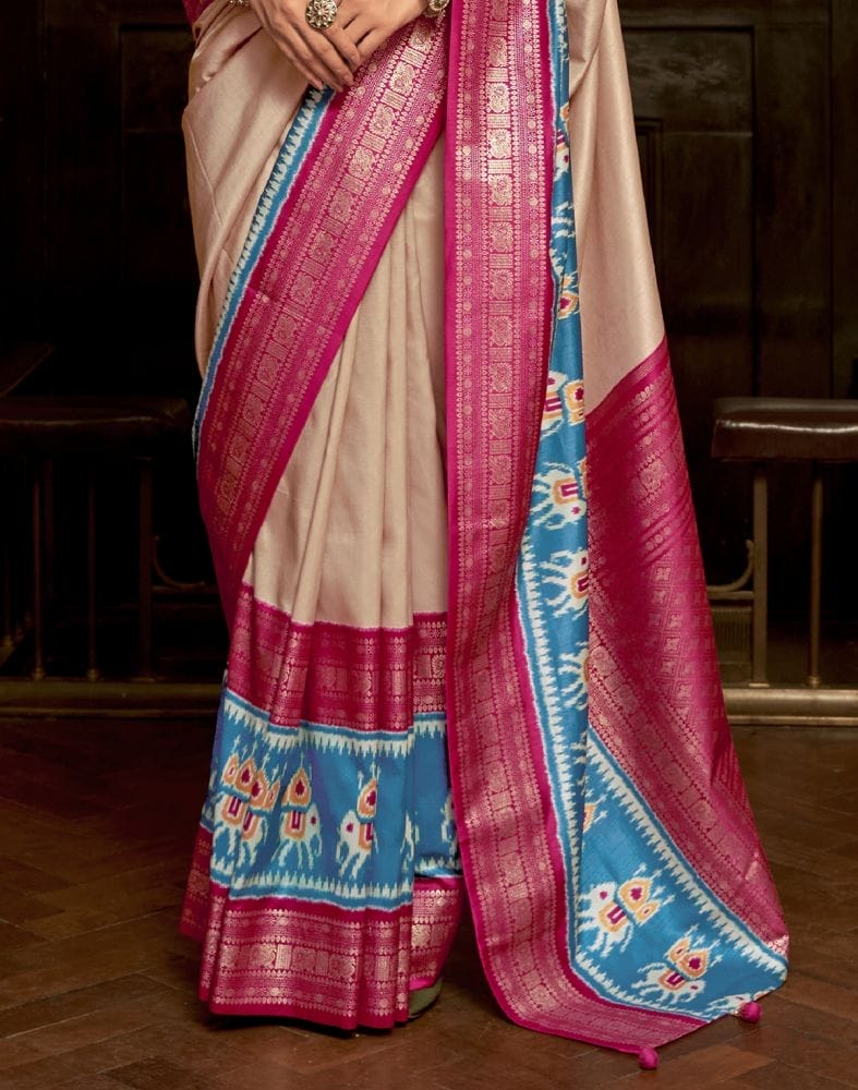 Collection of Cream Coloured Patola Fabric Saree in a gallery layout