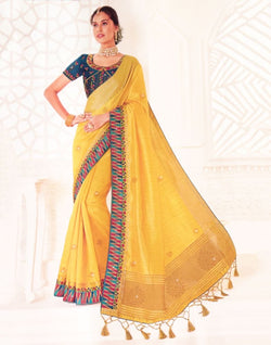 Collection of Yellow Plain Stones work Raw Silk Saree in a gallery layout