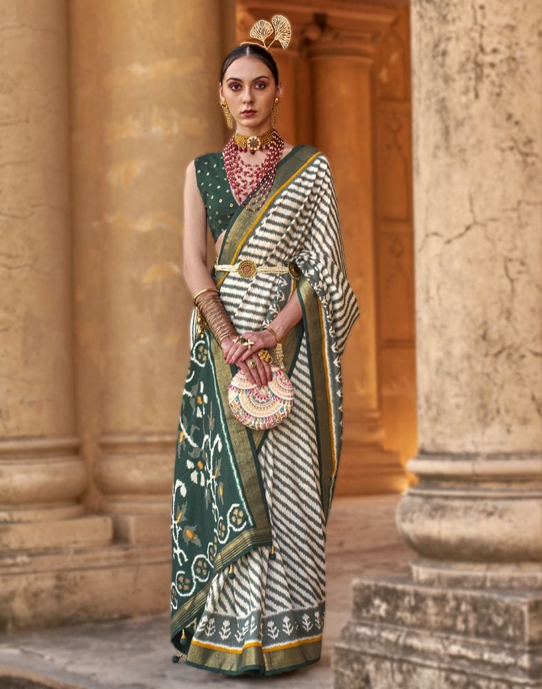 Collection of Off White Stripes Pattern Patola Fabric Saree in a gallery layout