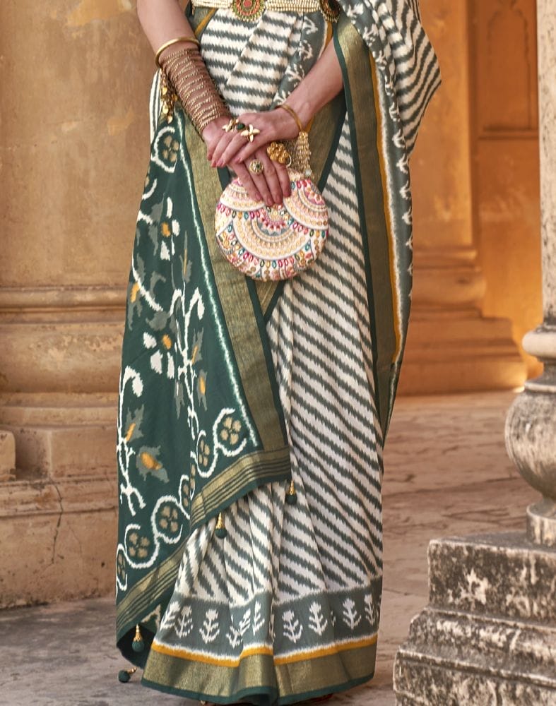 Collection of Off White Stripes Pattern Patola Fabric Saree in a gallery layout