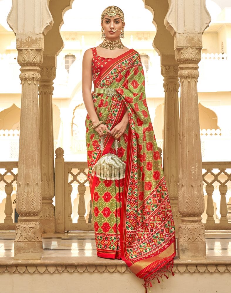 Collection of Mehendi Green Geometric Print Patola Butta Saree in a gallery layout