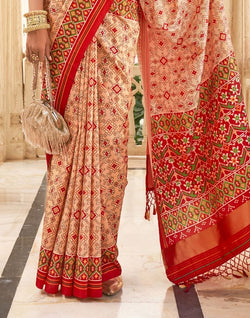 Collection of Peach Coloured Ikat Print Patola Fancy Saree in a gallery layout