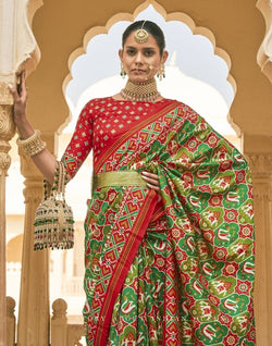 Collection of Dark Green Ikat Print Patola Fancy Saree in a gallery layout