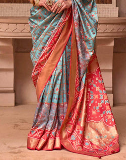 Collection of Stylish Sky Blue Color Ikat Print Patola Saree in a gallery layout