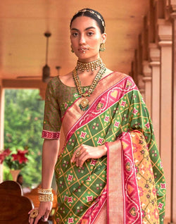 Collection of Trending Green Ikat Print Patola Saree in a gallery layout