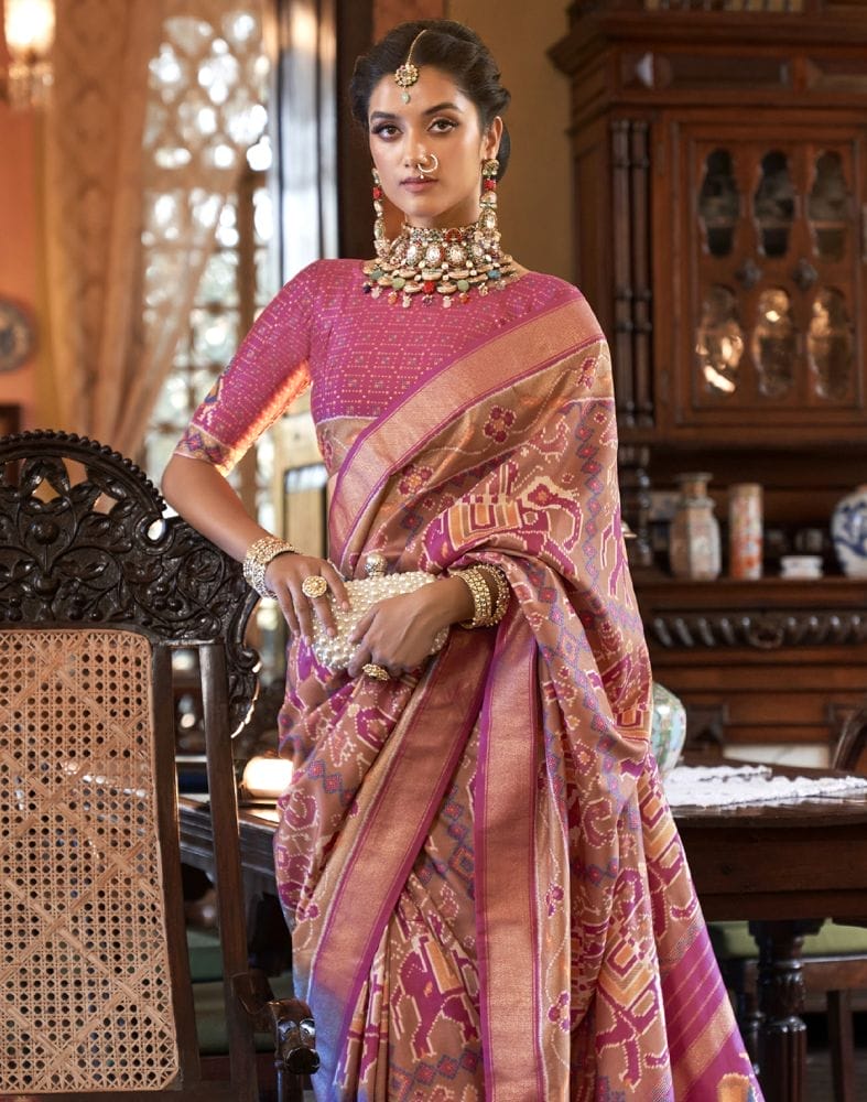 Collection of Peach Ikat Print Patola Fancy Saree in a gallery layout