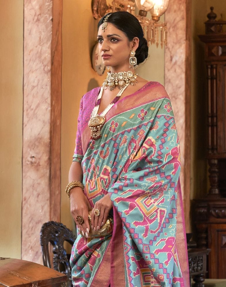 Collection of Sky Blue Ikat Print Patola Fabric Saree in a gallery layout