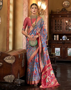 Collection of Patola Fabric Blue Coloured Ikat Print Saree in a gallery layout