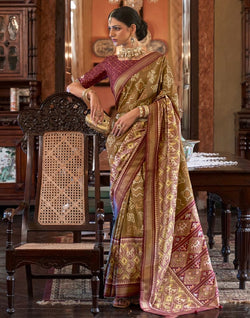 Collection of Brown Ikat Print Patola Silk Saree in a gallery layout