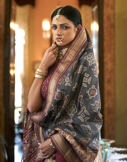 Collection of Grey Ikat Print Patola Fancy Saree in a gallery layout