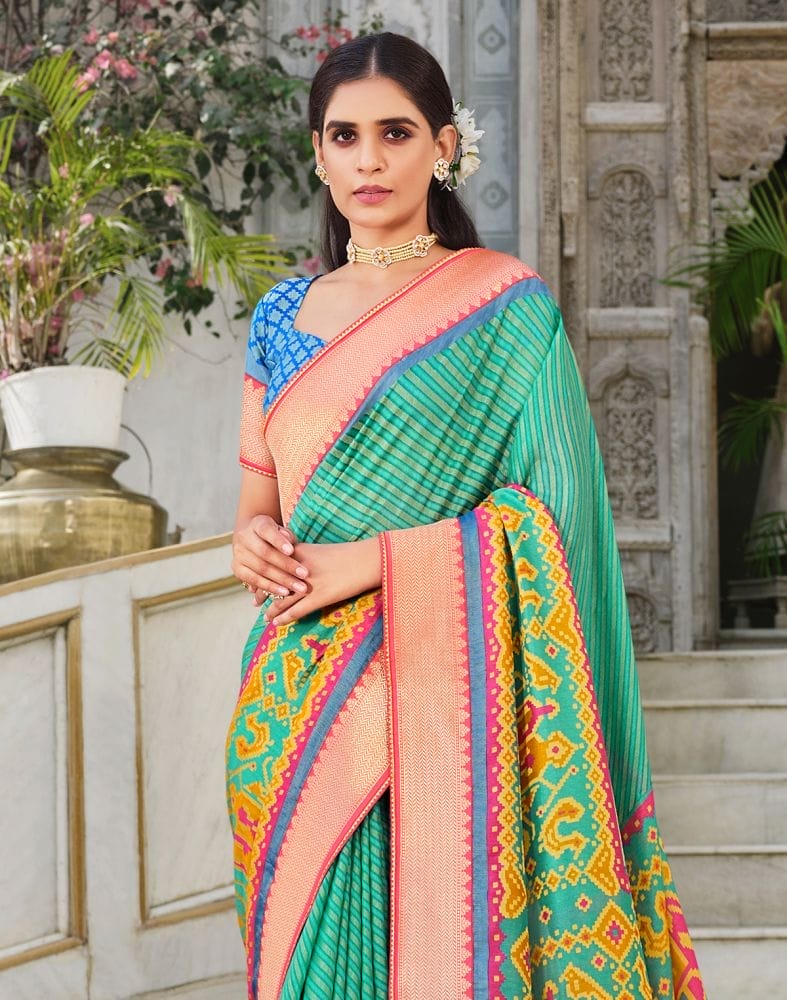 Collection of Brasso Pattern Sea Green Coloured Saree in a gallery layout