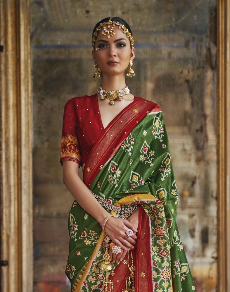 Collection of Gorgeous Green Ikat Print Dola Silk Saree in a gallery layout