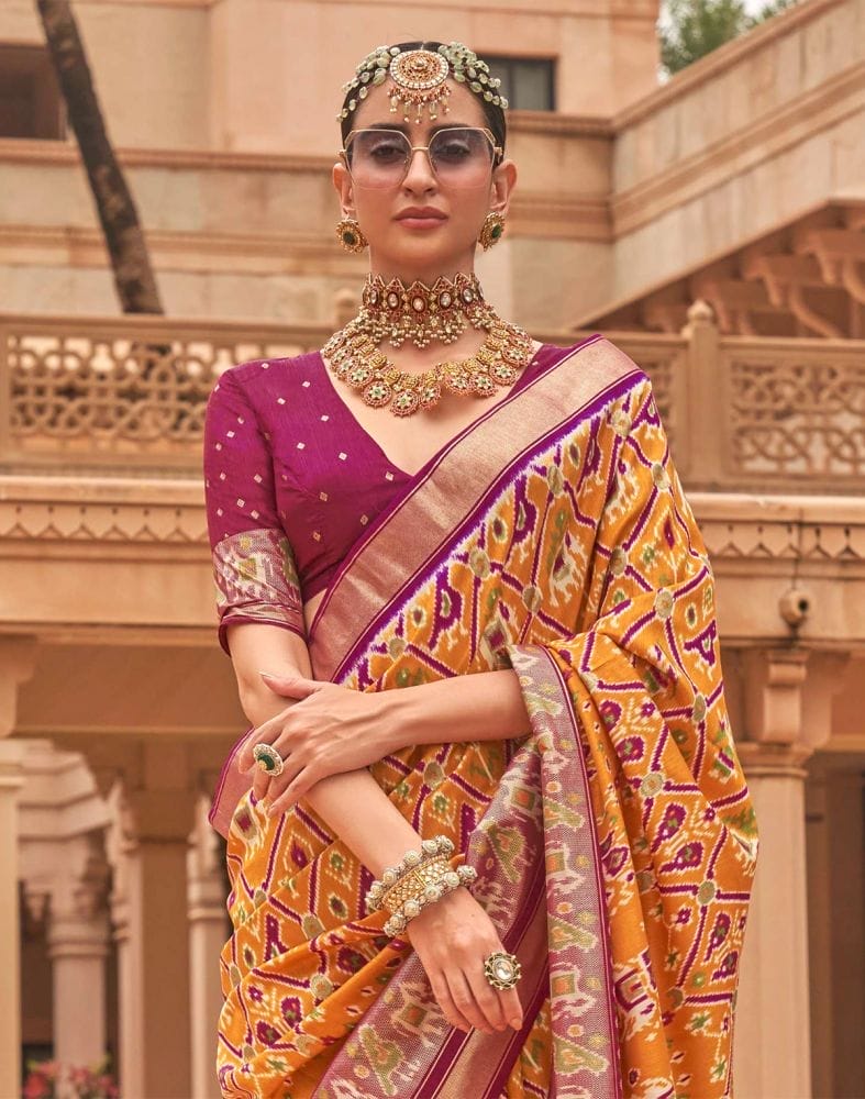 Collection of Mustard and Pink Ikat Print Patola Silk Saree in a gallery layout