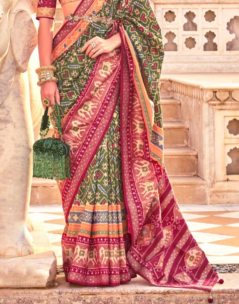 Collection of Mehendi Green Ikat Print Patola Saree in a gallery layout