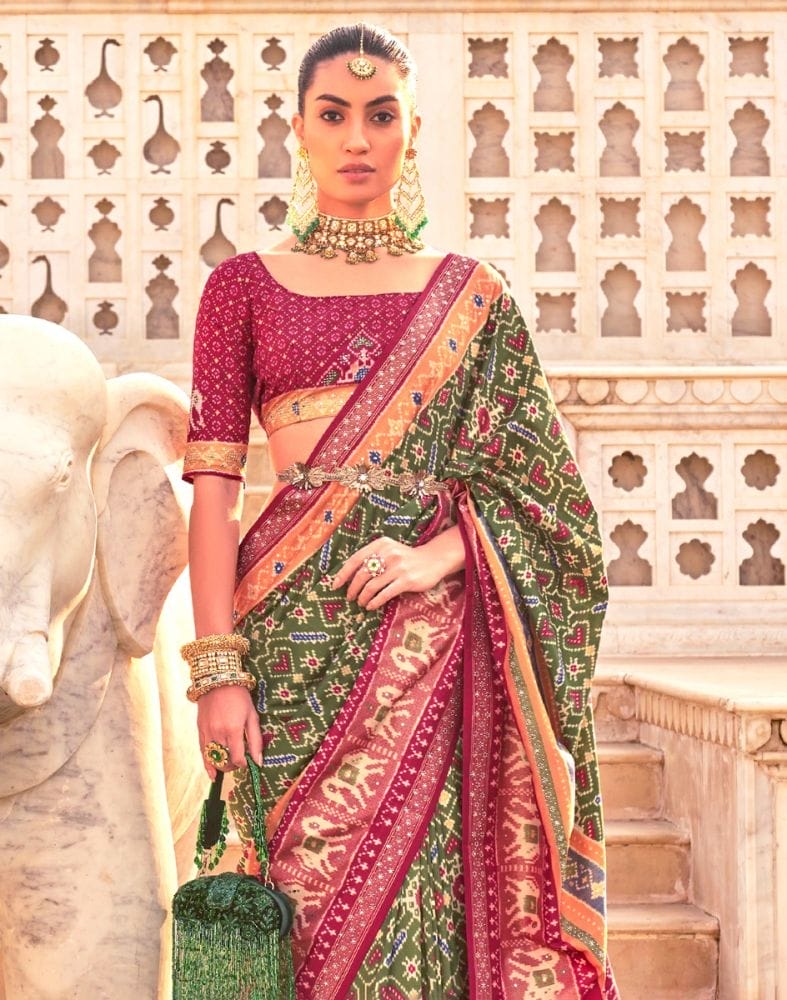 Collection of Mehendi Green Ikat Print Patola Saree in a gallery layout